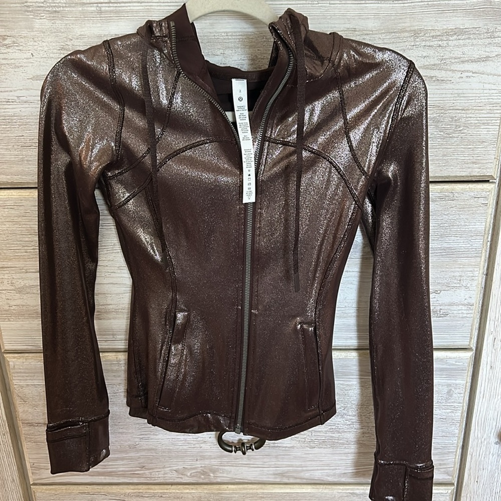 Metallic Lululemon zip up jacket with hood. Never worn!! Size 2